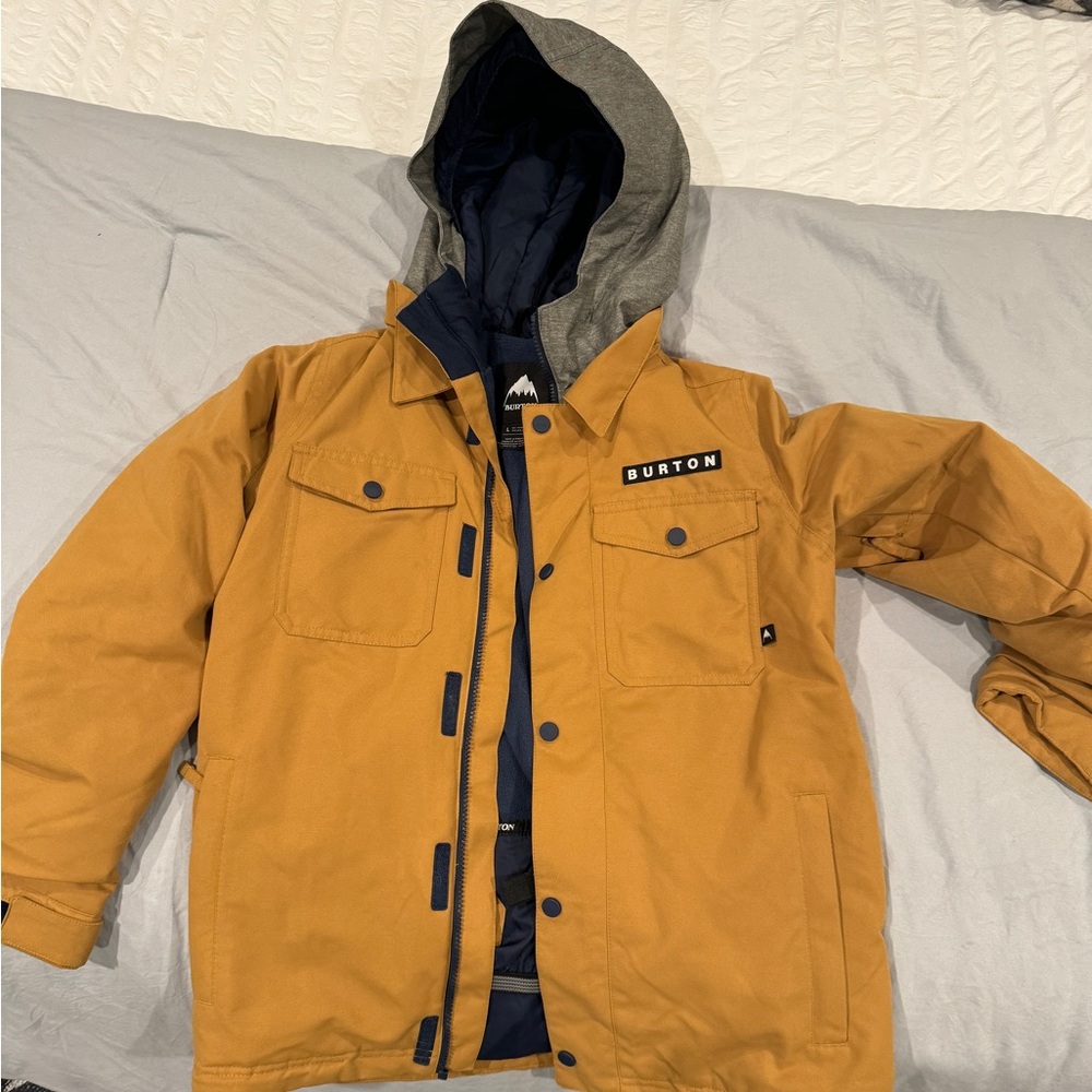 Burton snowboard jacket. “Room to grow” not used. Excellent condition.